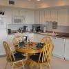 Well stocked kitchen for cooking.Space enough for dining with friends.